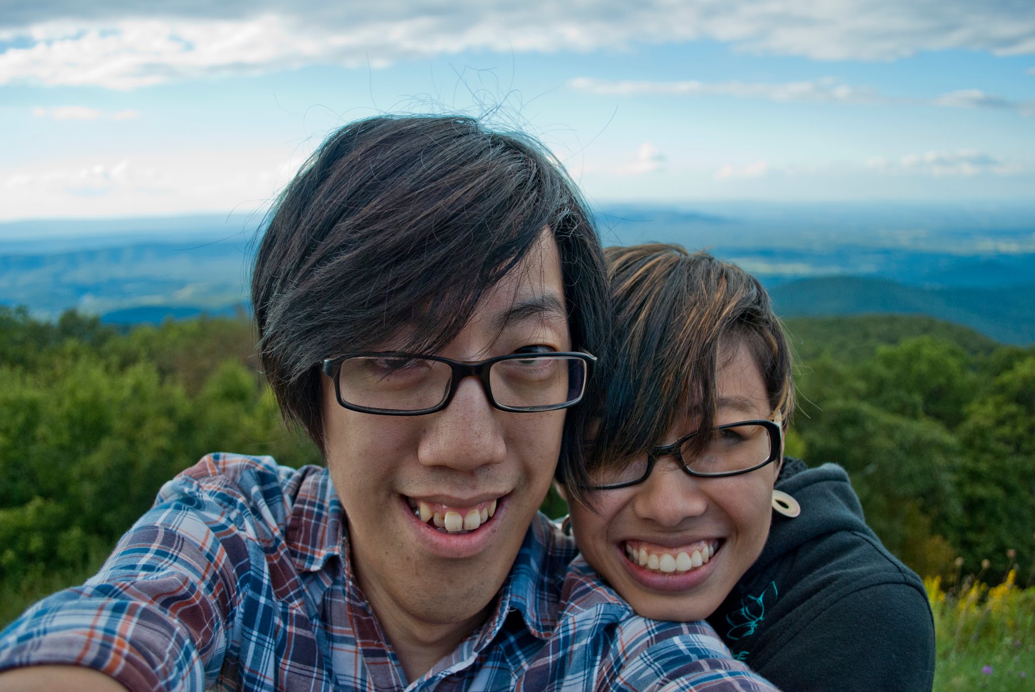 Andy and Michelle take a selfie in the Shenandoah Mountains. With the blue skies, green forests, and high elevation, it's possible to see a lot of Virginia in the distance.