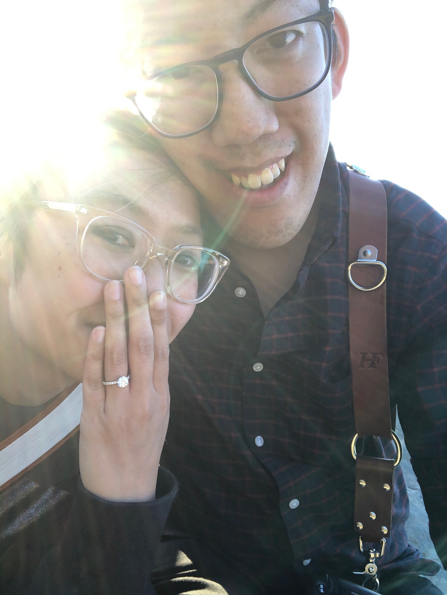 Selfie of Andy and Michelle shortly after the proposal. The sun is shining on Michelle and her new, very shiny diamond ring.